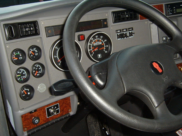 Ravelco key unit installed in the instrument cluster of a Kenworth T300 trailer truck